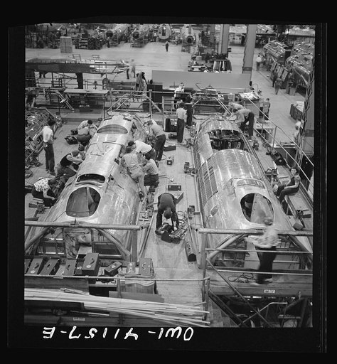 Untitled photo, possibly related to: Boeing aircraft plant, Seattle, Washington. Production of B-17F (Flying Fortress) bombing planes. Fuselage sections.