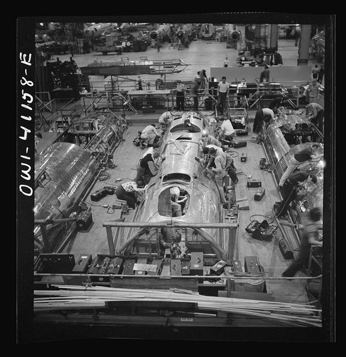 Untitled photo, possibly related to: Boeing aircraft plant, Seattle, Washington. Production of B-17F (Flying Fortress) bombing planes. Fuselage sections.