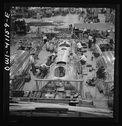 Untitled photo, possibly related to: Boeing aircraft plant, Seattle, Washington. Production of B-17F (Flying Fortress) bombing planes. Fuselage sections.