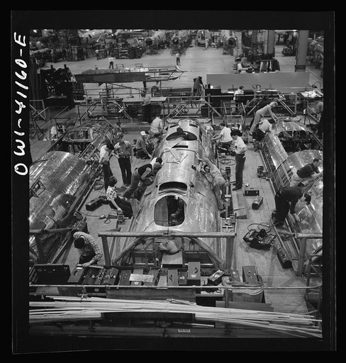 Untitled photo, possibly related to: Boeing aircraft plant, Seattle, Washington. Production of B-17F (Flying Fortress) bombing planes. Fuselage sections.