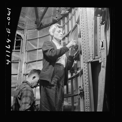 Boeing aircraft plant, Seattle, Washington. Production of B-17F (Flying Fortress) bombing planes. Workers completing a fuselage framework