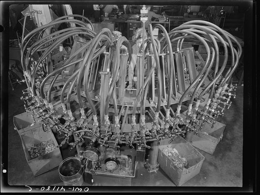 Untitled photo, possibly related to: Boeing aircraft plant, Seattle, Washington. Production of B-17 (Flying Fortress) bombing planes. Octupus punching machine working on parts for B-17 (Flying Fortress) bombers