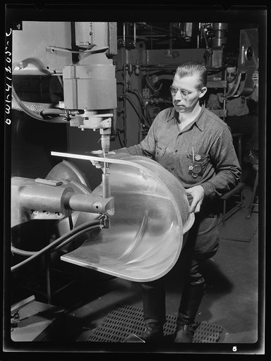 Boeing aircraft plant, Seattle, Washington. Production of B-17 (Flying Fortress) bombing planes. An electric spot welding job for a B-17 (Flying Fortress) bomber