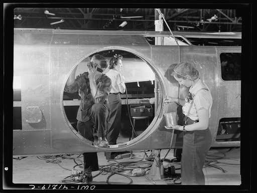 Untitled photo, possibly related to: Boeing aircraft plant, Seattle, Washington. Production of B-17F (Flying Fortress) bombing planes. Fuselage sections.