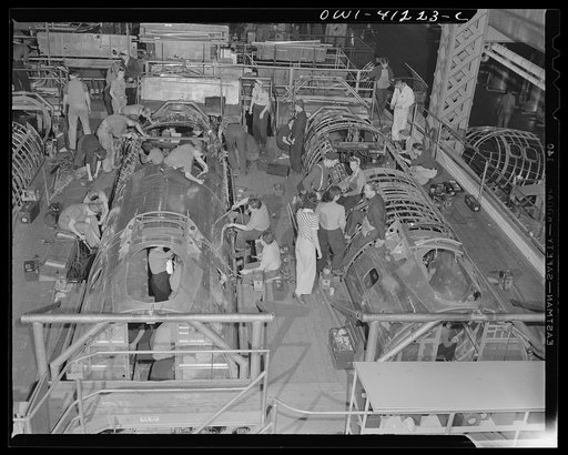 Untitled photo, possibly related to: Boeing aircraft plant, Seattle, Washington. Production of B-17F (Flying Fortress) bombing planes. Fuselage sections.