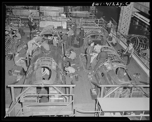 Untitled photo, possibly related to: Boeing aircraft plant, Seattle, Washington. Production of B-17F (Flying Fortress) bombing planes. Fuselage sections.