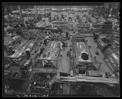 Untitled photo, possibly related to: Boeing aircraft plant, Seattle, Washington. Production of B-17F (Flying Fortress) bombing planes. Fuselage sections.