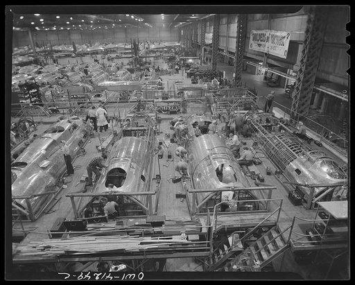 Untitled photo, possibly related to: Boeing aircraft plant, Seattle, Washington. Production of B-17F (Flying Fortress) bombing planes. Fuselage sections.