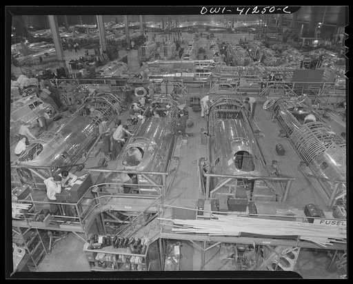 Untitled photo, possibly related to: Boeing aircraft plant, Seattle, Washington. Production of B-17F (Flying Fortress) bombing planes. Fuselage sections.