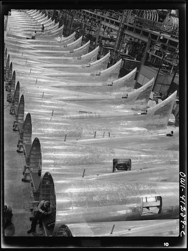 Untitled photo, possibly related to: Boeing aircraft plant, Seattle, Washington. Production of B-17F (Flying Fortress) bombing planes. Tail section of B-17F (Flying Fortress) bombers
