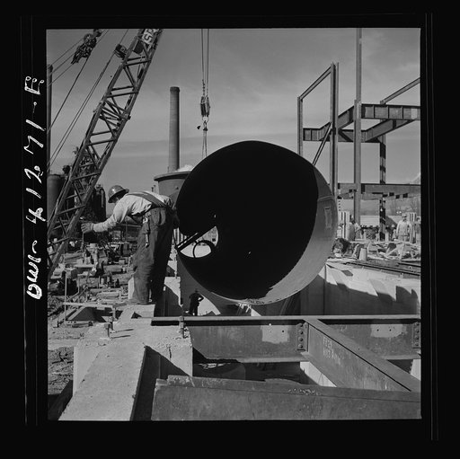 Untitled photo, possibly related to: Bingham Canyon, Utah. Building a trestle bridge at the open-pit mine workings of the Utah Copper Company