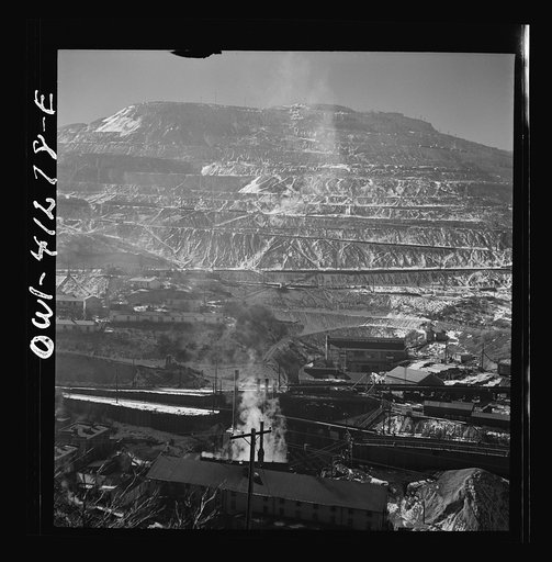 Untitled photo, possibly related to: Bingham Canyon, Utah. Open-pit workings of the Utah Copper Company, showing loaded ore trains in the foreground