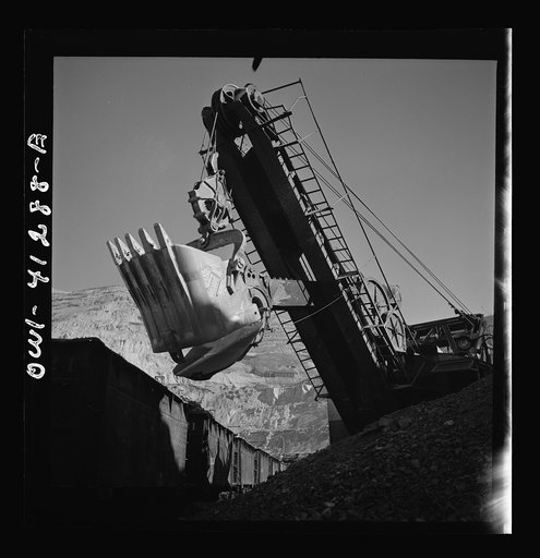 Bingham Canyon, Utah. Huge dipper of a power shovel loading ore into a car at a mine of the Utah Copper Company