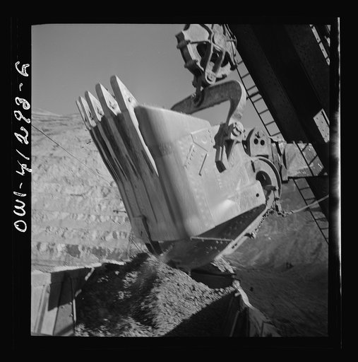 Untitled photo, possibly related to: Bingham Canyon, Utah. Huge dipper of a power shovel loading ore into a car at a mine of the Utah Copper Company