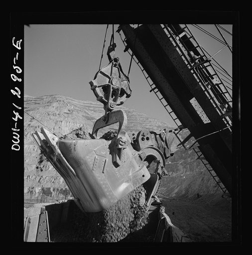 Untitled photo, possibly related to: Bingham Canyon, Utah. Huge dipper of a power shovel loading ore into a car at a mine of the Utah Copper Company