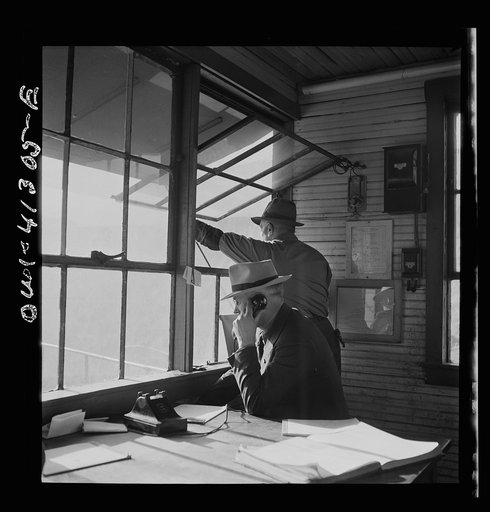 Bingham Canyon, Utah. Executives who keep heavy ore production coming from the open-pit mines of the Utah Copper Company looking out over the mine workings