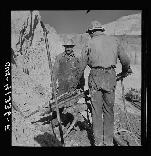 Bingham Canyon, Utah. Drilling blast holes with a rock-drill machine in an open-pit mine operated by the Utah Copper Company