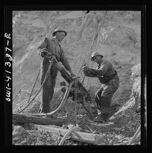 Bingham Canyon, Utah. Drilling blast holes with a rock-drill machine in an open-pit mine operated by the Utah Copper Company