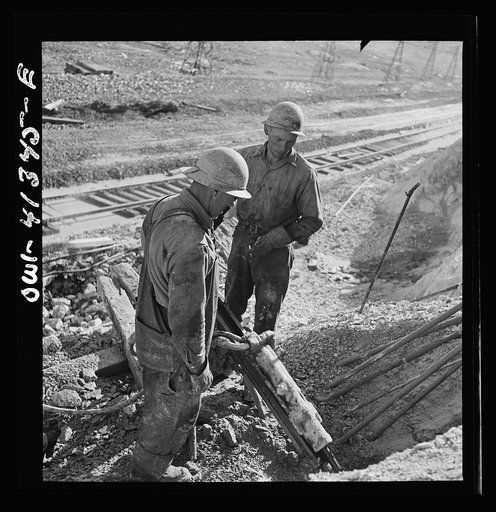 Bingham Canyon, Utah. Drilling blast holes with a rock-drill machine in an open-pit mine operated by the Utah Copper Company