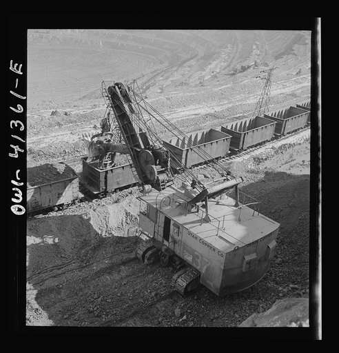Untitled photo, possibly related to: Bingham Canyon, Utah. Loading ore into car with a power shovel at an open-pit mine of the Utah Copper Company