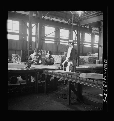 Untitled photo, possibly related to: Phelps Dodge refining company, El Paso Texas. Interior of the plant showing stacks of wire bars