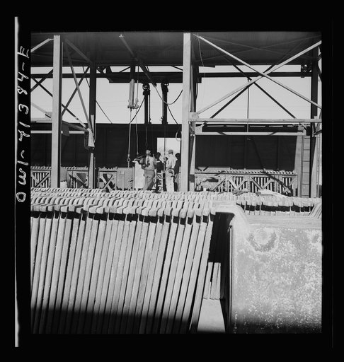 Untitled photo, possibly related to: El Paso, Texas, Phelps Dodge refining company. Electrolytic tanks in which sheets of pure copper are formed. The sheets are later melted and cast into ingots