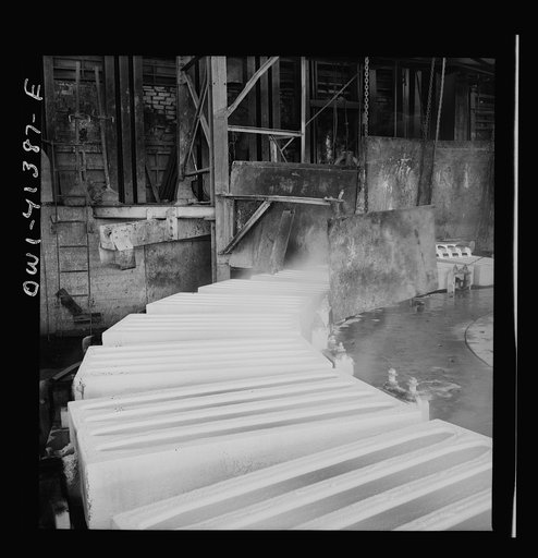 Untitled photo, possibly related to: Phelps Dodge refining company, El Paso, Texas. Sheets of pure copper, which had been formed by electrolysis in huge tanks, being melted now and cast into ingots