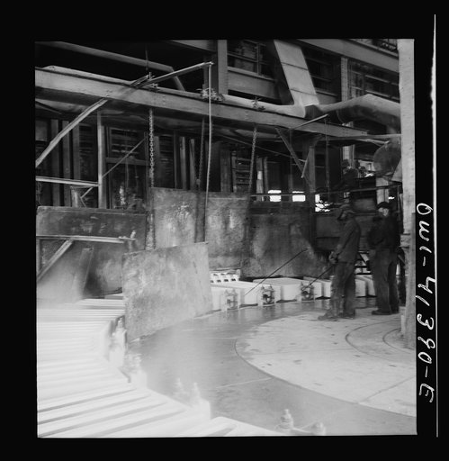 Untitled photo, possibly related to: Phelps Dodge refining company, El Paso, Texas. Sheets of pure copper, which had been formed by electrolysis in huge tanks, being melted now and cast into ingots