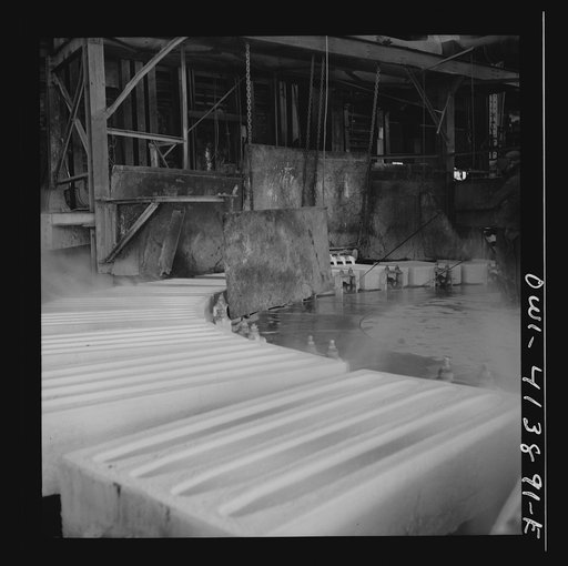 Untitled photo, possibly related to: Phelps Dodge refining company, El Paso, Texas. Sheets of pure copper, which had been formed by electrolysis in huge tanks, being melted now and cast into ingots