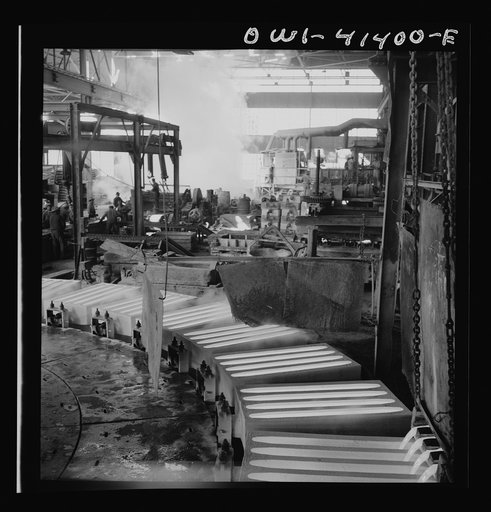 Untitled photo, possibly related to: Phelps Dodge refining company, El Paso, Texas. Sheets of pure copper, which had been formed by electrolysis in huge tanks, being melted now and cast into ingots