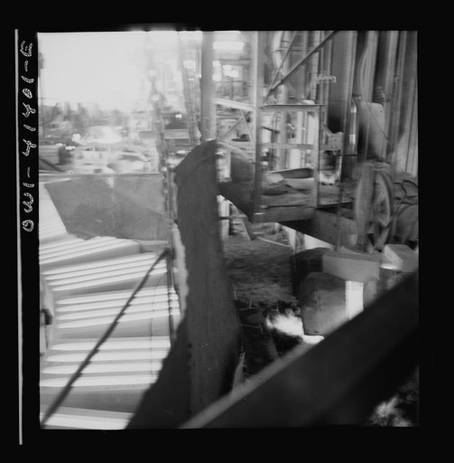 Untitled photo, possibly related to: Phelps Dodge refining company, El Paso, Texas. Sheets of pure copper, which had been formed by electrolysis in huge tanks, being melted now and cast into ingots