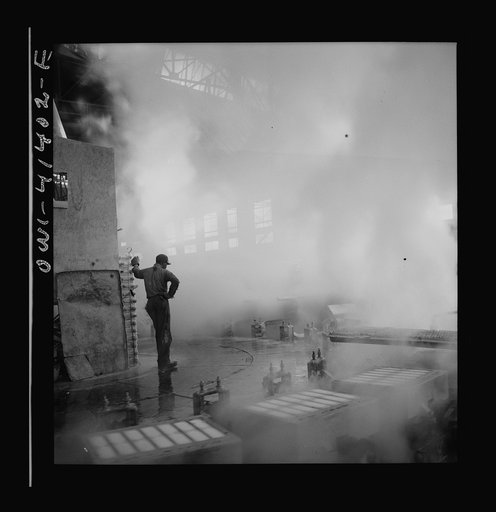 Untitled photo, possibly related to: Phelps Dodge refining company, El Paso, Texas. Sheets of pure copper, which had been formed by electrolysis in huge tanks, being melted now and cast into ingots