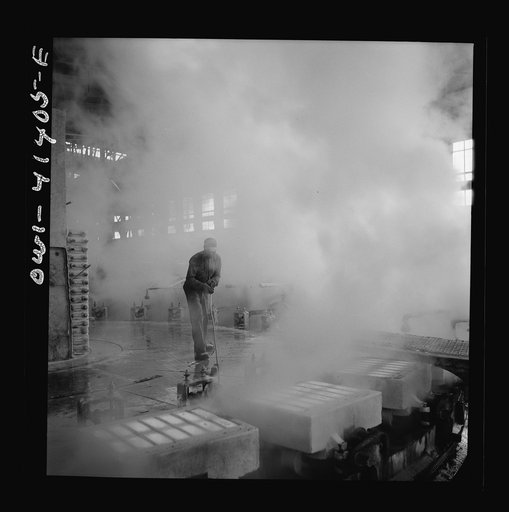 Untitled photo, possibly related to: Phelps Dodge refining company, El Paso, Texas. Sheets of pure copper, which had been formed by electrolysis in huge tanks, being melted now and cast into ingots