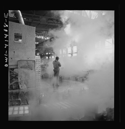 Untitled photo, possibly related to: Phelps Dodge refining company, El Paso, Texas. Sheets of pure copper, which had been formed by electrolysis in huge tanks, being melted now and cast into ingots