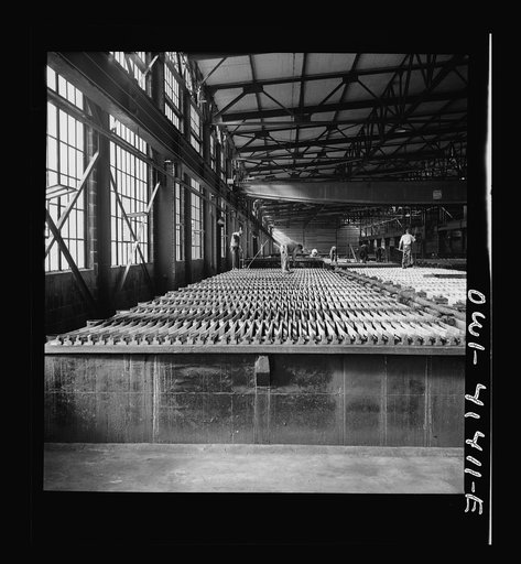 El Paso, Texas. Phelps Dodge refining company. Sheets of pure copper are formed by electrolysis in large tanks in later melted and poured into ingots