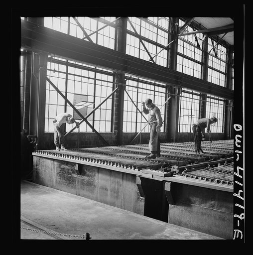 El Paso, Texas, Phelps Dodge refining company. Electrolytic tanks in which sheets of pure copper are formed. The sheets are later melted and cast into ingots