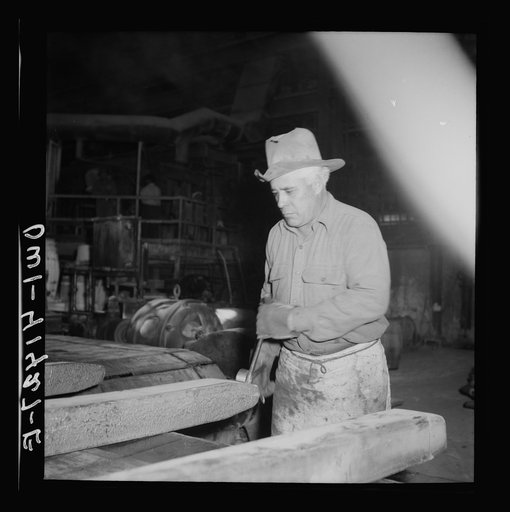 El Paso, Texas. Workman trimming an ingot at the Phelps Dodge refining plant
