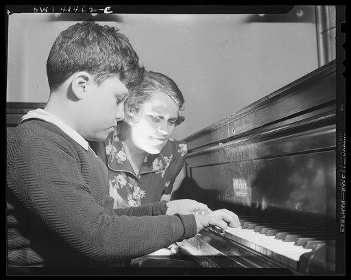 New York, New York. A blind youngster getting his weekly piano lesson at the Lighthouse, an institution for the blind, at 111 East Fifty-ninth Street
