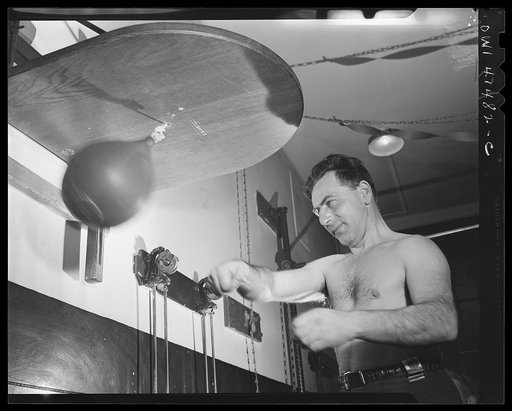 New York, New York. Joe Bruno (blind) punching the bag in the gymnasium at the Lighthouse, an institution for the blind, at 111 East Fifty-ninth Street