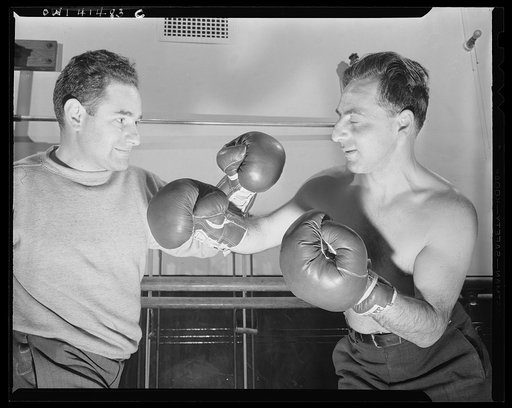 New York, New York. Maurice Case, boxing instructor, giving instructions to Joe Bruno (blind) at the Lighthouse, an institution for the blind, at 111 East Fifty-ninth Street