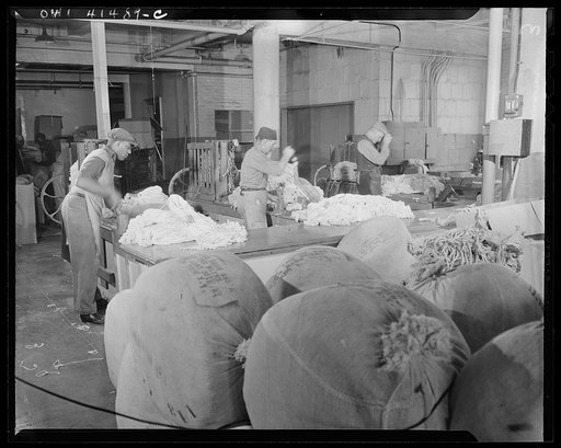 New York, New York. Cutting and bailing mop lengths at the Lighthouse, an institution for the blind, at 111 East Fifty-ninth Street