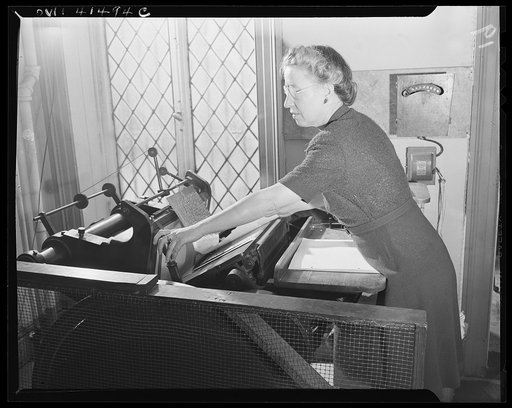 New York, New York. Charlotte Rohr operating the Braille press at the Lighthouse, an institution for the blind, at 111 East Fifty-ninth Street