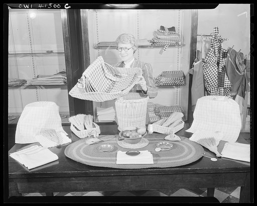 New York, New York. Miss Kanner, one of the members of the staff, showing the handiwork of the Lighthouse, an institution for the blind, at 111 East Fifty-ninth Street
