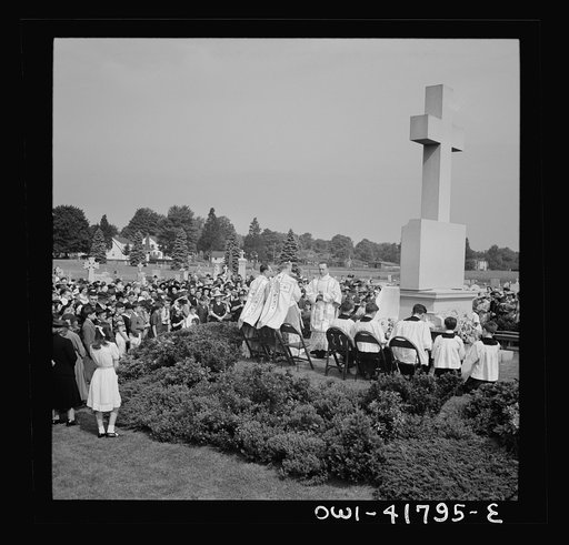 Southington, Connecticut. On Memorial Day the Catholic congregation is gathering in the Saint Thomas cemetery for an outdoor Mass which in 1942 was officiated by the Reverend Francis J. Mihalek