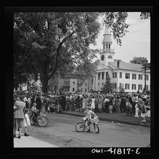 Southington, Connecticut. An American town and its way of life. The Memorial Day parade moving down the main street. The small number of spectators is accounted for by the fact that the town's factories did not close