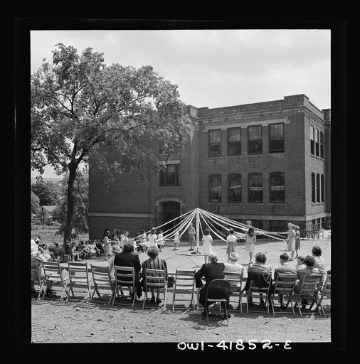 Southington, Connecticut. At Beecher Street School, whose student body consists half of Americans of Italian descent and half of Americans of Polish descent. The Queen of May was Emily Shuvak, of Polish extraction; the King was Philip D'Agostino, of Italian descent