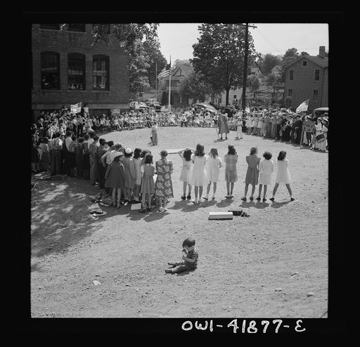 Southington, Connecticut. Young people watching a game