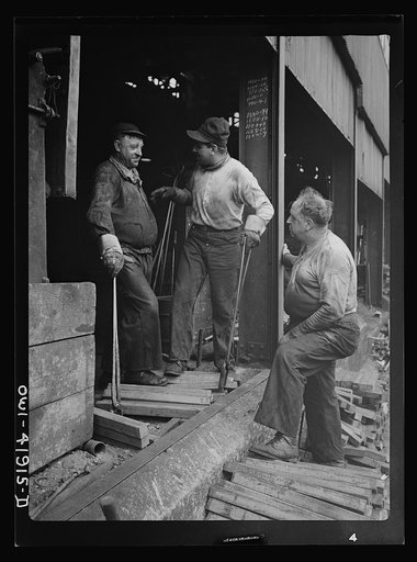 Southington, Connecticut. Workers talking to the foreman