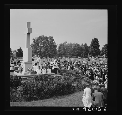 Southington, Connecticut. On All Souls' Day, the Catholic congregation is gathering in the Saint Thomas Cemetery for an outdoor Mass which in 1942 was officiated by the Reverend Francis J. Mihalek