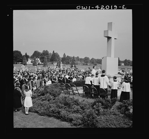 Southington, Connecticut. On All Souls' Day, the Catholic congregation is gathering in the Saint Thomas Cemetery for an outdoor Mass which in 1942 was officiated by the Reverend Francis J. Mihalek